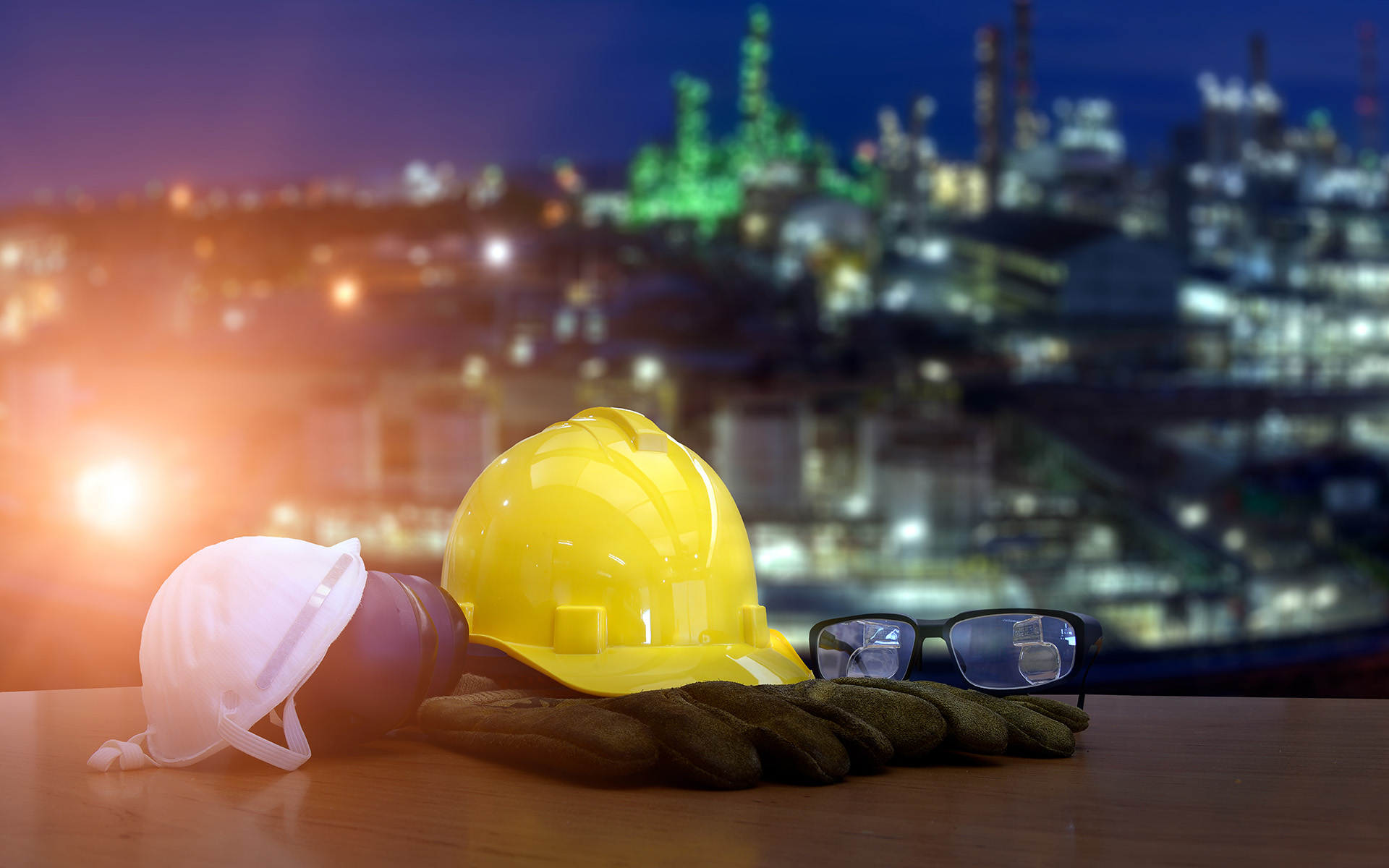Double exposure of safety helmet  and safety equipment on blurred background of oil refinery plant  for your work .Concept for safety on work .