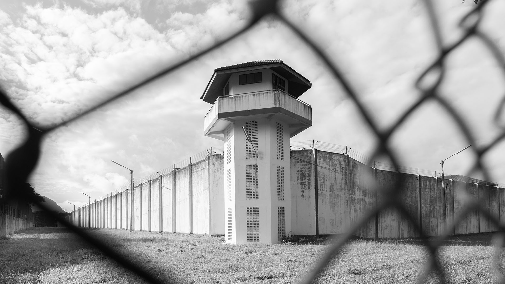 Prison with iron fences.Prison or jail is a building where people are forced to live if their freedom has been taken away.Prison is the building use for punishment prisoner.